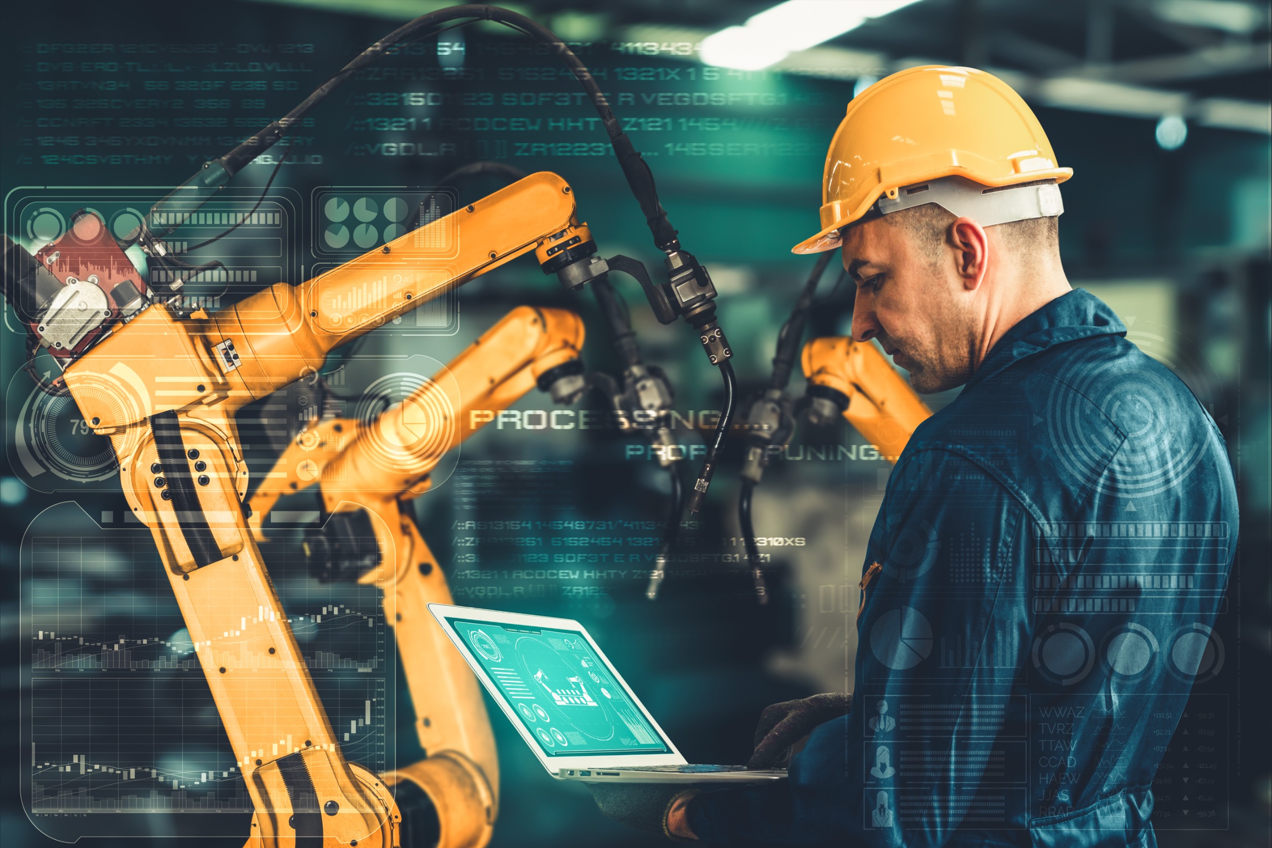 technicien industriel dans une usine avec robot et un ordinateur technicien industriel dans une usine avec robot et un ordinateur
